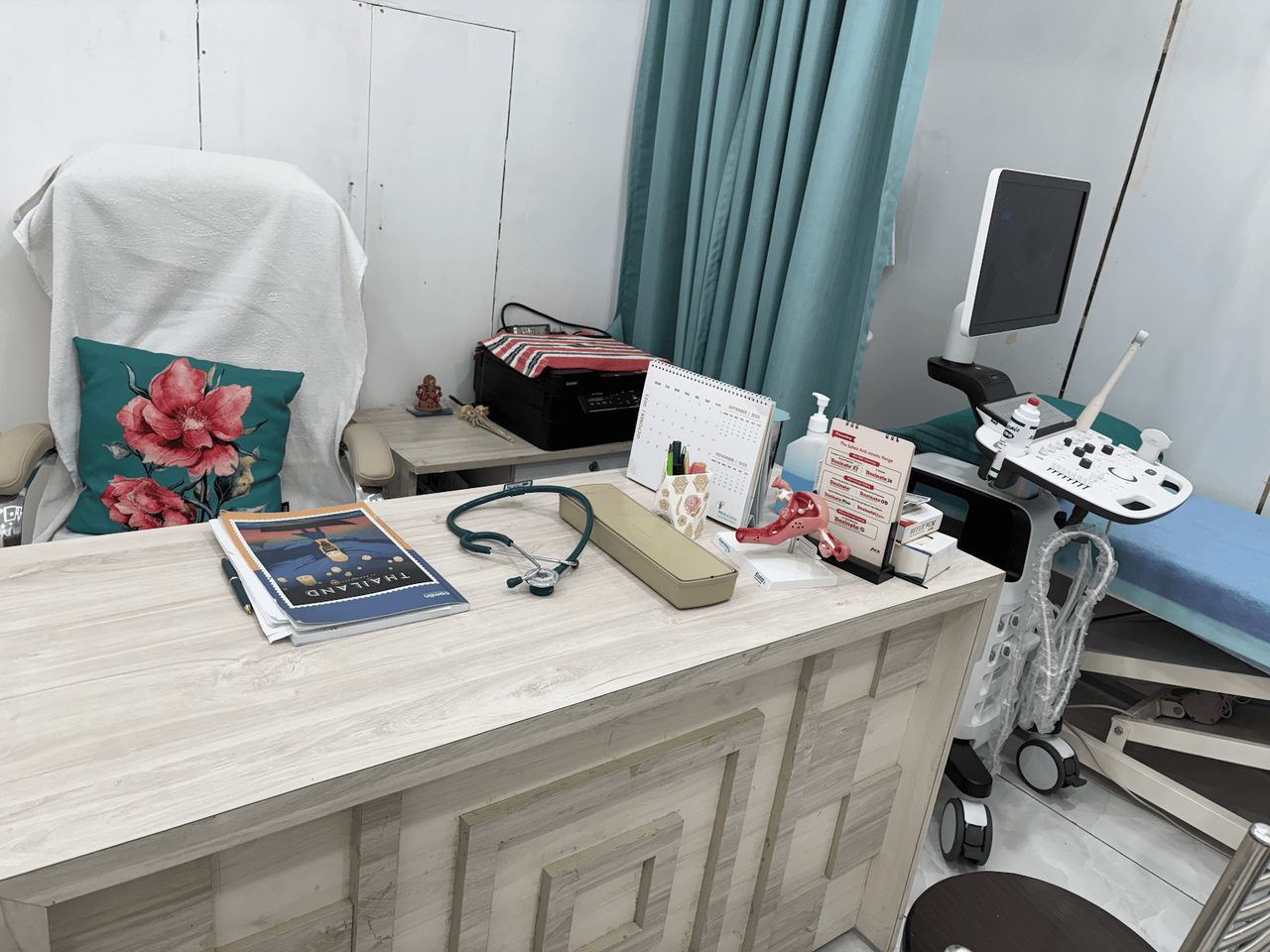 Consultation room with ultrasound equipment at Aram Clinic, Tenkasi